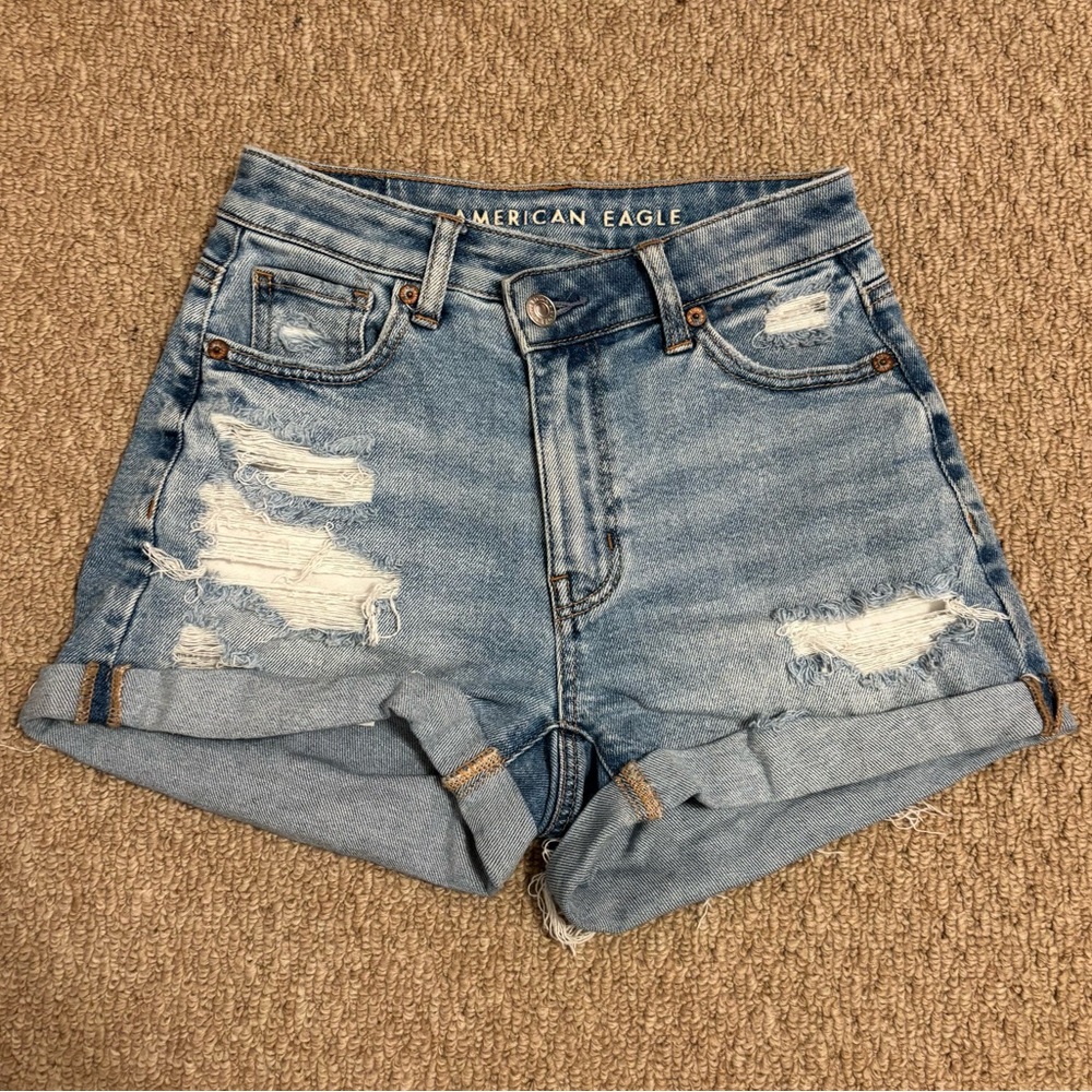 american eagle blue distressed high rise asymmetrical button mom shorts